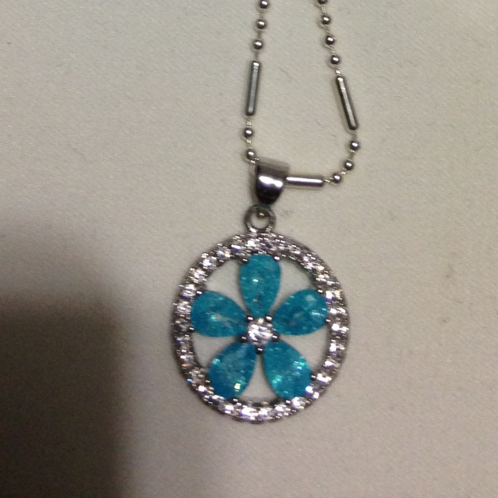ICE BLUE TOPAZ FLOWER PENDANT